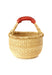 Small bolga basket, made in Ghana from tan elephant grass and red brown leather. 