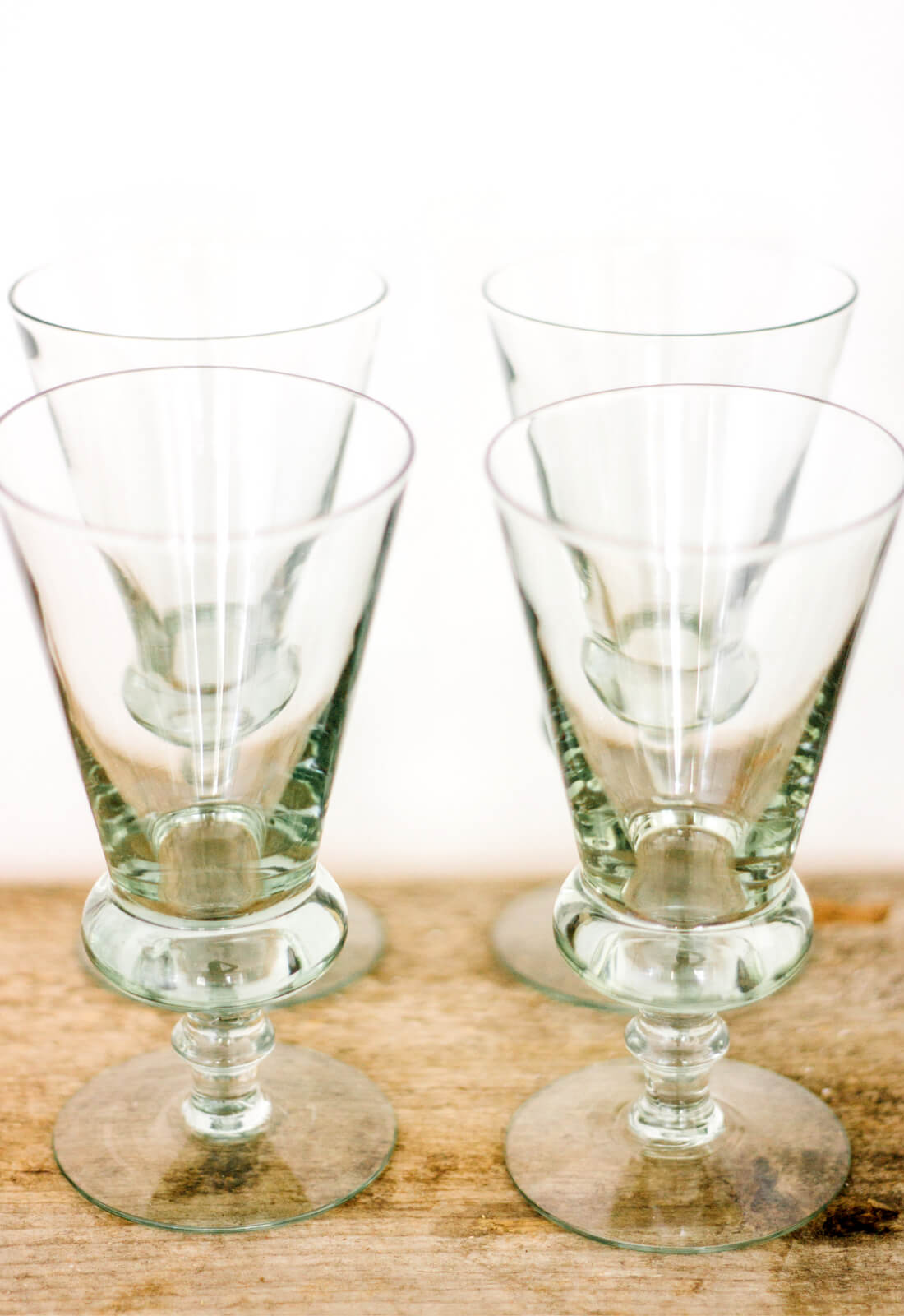 Set of 4 recycled glass wine glasses, made in Swazilsnd with an olive green tint 