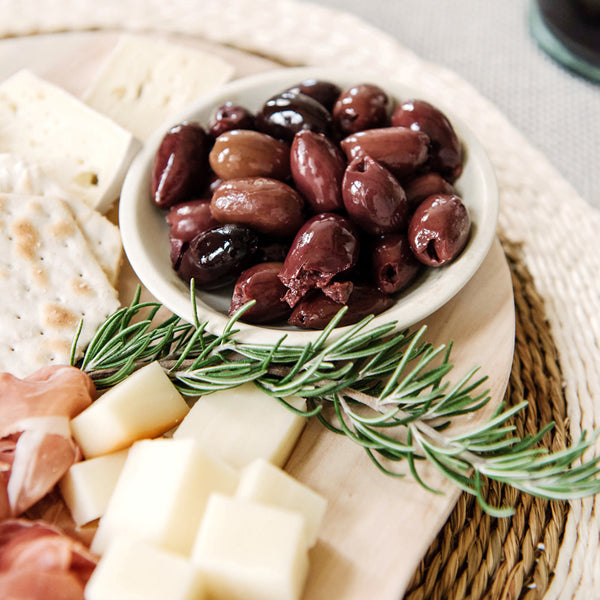Charcuterie with olives in a soapstone bowl 