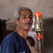 Moroccan glassblower making a drinking glass 