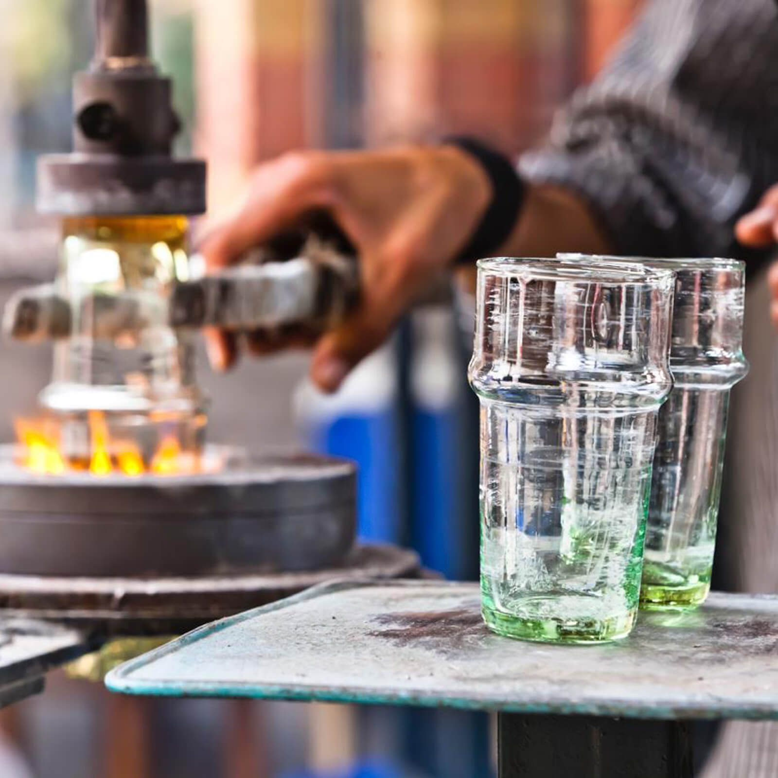 Moroccan glassblowers making recycled drinking glasses 