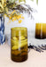 Amber colored recycled Moroccan drinking glasses, styled on a dining table 
